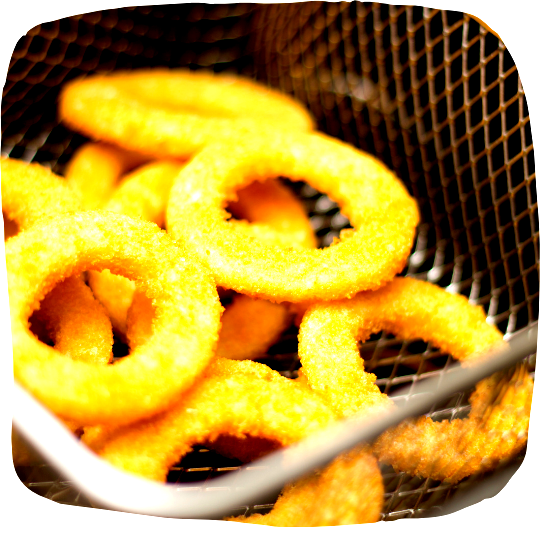 Image of Preheat an air fryer to 400°F (200°C). Place the rings...